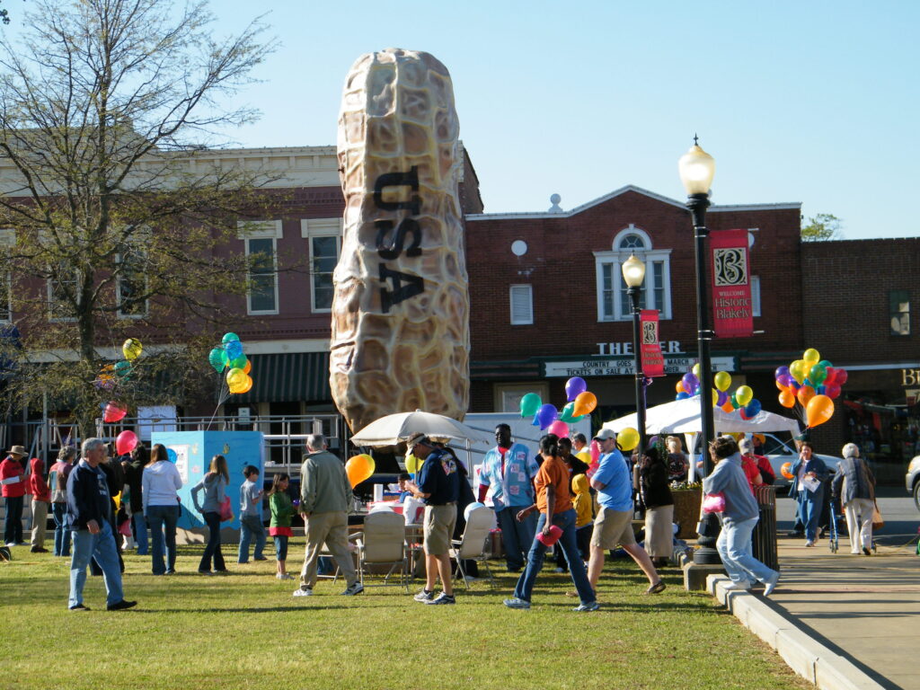 peanut-proud-festival-giant-peanut-statue-with-historic-buildings-in-background