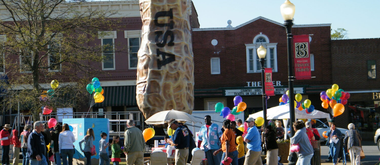 peanut-proud-festival-giant-peanut-statue-with-historic-buildings-in-background