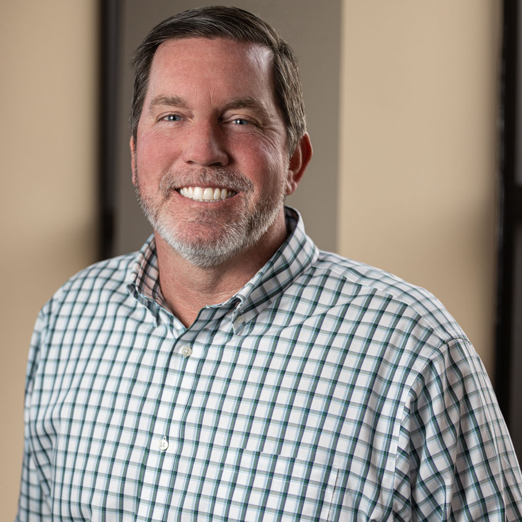 corporate headshot of middle-aged man