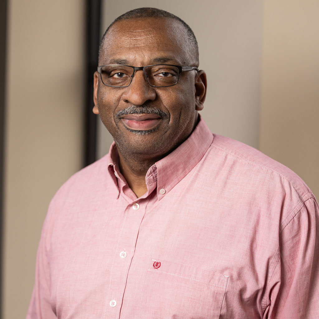 corporate headshot of middle-aged man