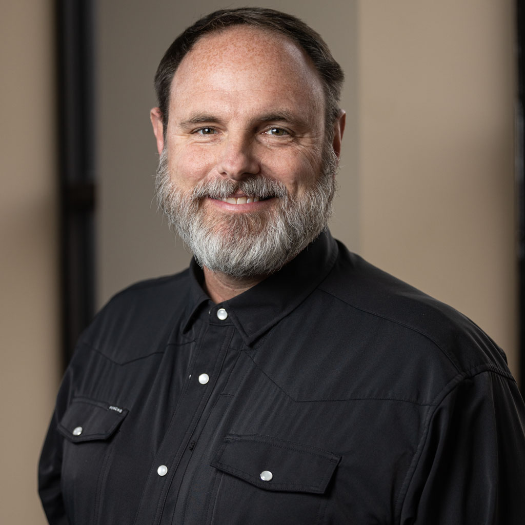 corporate headshot of middle-aged man