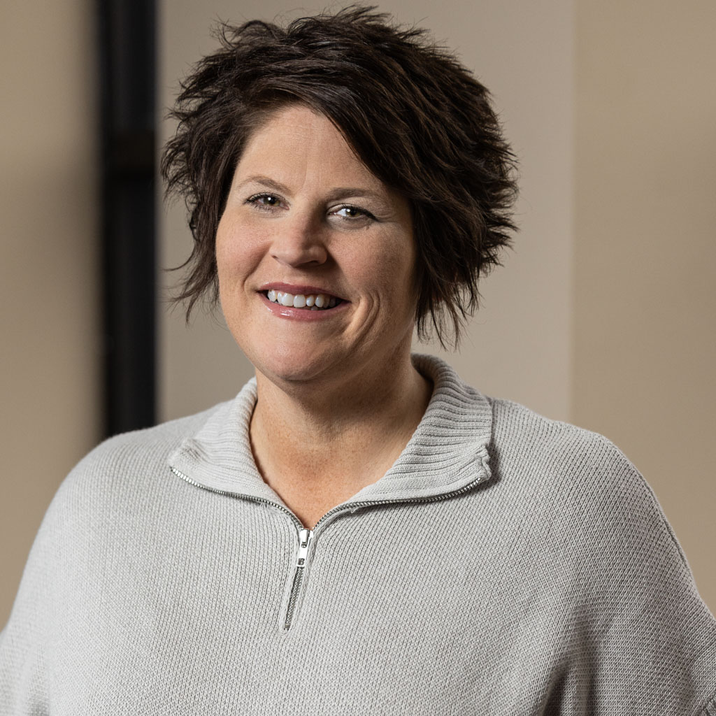 corporate headshot of middle-aged woman